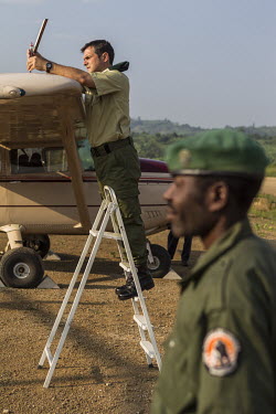 Prince Emmanuel de Merode the director of Virunga National Park, checking the light aircraft used by the park's rangers.