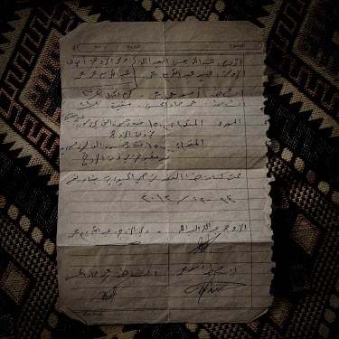 Abeer Muhammed's marriage certificate. She was married as a teenager in Syria, by candlelight and this is all that remains of her marriage. The wedding was performed by a sheikh in war-torn Aleppo. It...