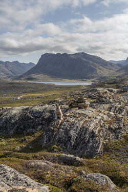 A lone pup sits on the rocks above 'Dog City' an area outside Sisimiut where Greenland sled dogs are kept.