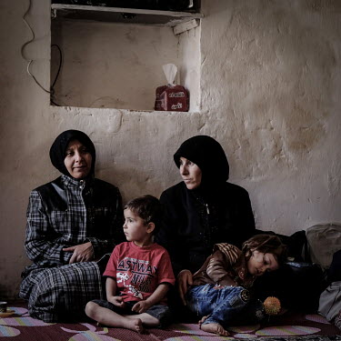 A meeting, held in a volunteer's home, of the charity Zenobia. Amina Dabko (42, R) said that she felt she had no choice but to marry off her eldest daughter at 14. Many women described how they had ne...