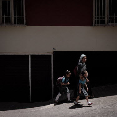 Turkish children walk to their mixed school of Syrian and Turkish children in the Gulen district.