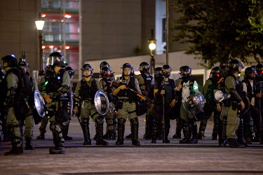 Armoured riot police protect government buildings in the Admiralty District of Hong Kong during an event held in commemoration of the 5th Anniversary of the start of the 2014 'Umbrella Revolution'.