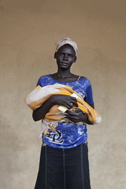 Abuk Cham (32) with her baby who is being treated at a mother and baby nutrition clinic for malnourished children.