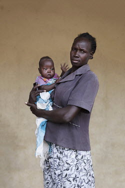 Akuac Mayen (35) with her baby who is being treated at a mother and baby nutrition clinic for malnourished children.