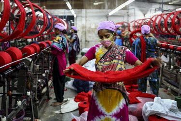 Textiles workers on the factory floor.