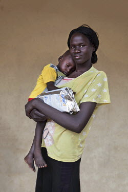 A mother and her baby who is being treated at a mother and baby nutrition clinic for malnourished children.