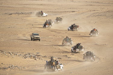 Vehicles packed with migrants from all across West Africa set off to cross the Tenere, a region of the Sahara Desert, in order to reach Libya and beyond.