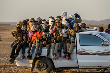 Vehicles packed with migrants from all across West Africa set off to cross the Tenere, a region of the Sahara Desert, in order to reach Libya and beyond.