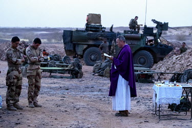 A priest says mass at a temporary French army base during Operation Koufra which was part of the larger Operation Barkhane. The soldiers were searching for Islamist terrorists from EIGS (Islamic State...