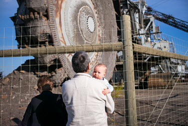 Pat (left) and Bill Lees with their grandson Austin at the 'Giants of Mining' tourist attraction, north of Fort McMurray, Austin's father works in the oil sands industry to support the family.