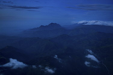A view of a mountain range from a plane crossing the Timor Leste coast line. The mountains on the island are believed to be the spine of a friendly crocodile that helped carry the country's founding a...