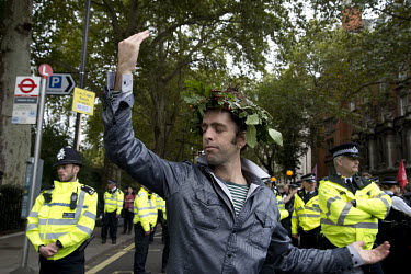A man dances in the street during an Extinction Rebellion protest in central London.
