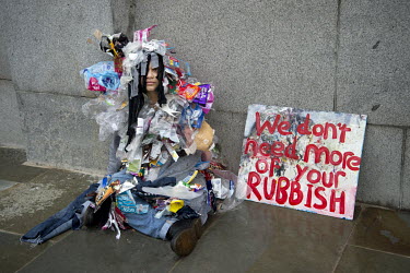 Lili makes a protest about rubbish during Extinction Rebellion protests in Trafalgar Square.