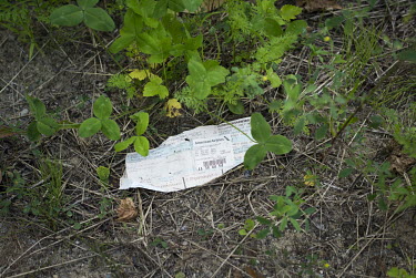 An old airline ticket lies on the ground at a point popular with asylum seekers making the illegal crossing from the US into Canada.