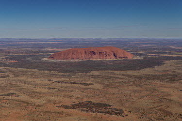A view of Uluru from a commercial plane, landing at Ayers Rock Airport.   Tourists are rushing to climb world heritage-listed Monolith, Uluru in Australia's central desert before a ban on climbers t...