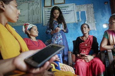 Pratima Baral, a data scientist, leading a workshop teaching female farmers about mobile technologies that can help with crop yields, pest control, markets and labour etc.