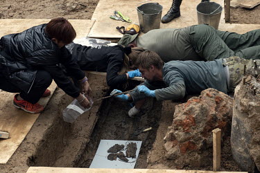 French and Russian archeologists working at excavations on the King's Bastion take samples for testing to confirm what they think to be the burial place of General Gudin, who died after being hit by a...