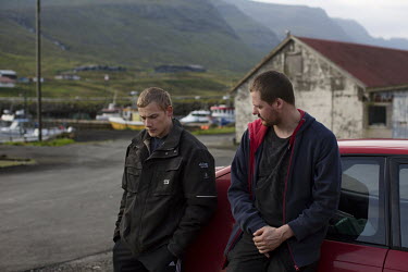 Tummas and Niklas Roi talking together in a car park at the town's harbour.