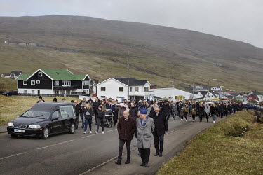 The entire village, more than 400 people, follows Johan F. Magnussen (87) to the grave. The funeral was held in the church in Midvagur. Johan had eight children, 23 grandchildren, 18 great grandchildr...