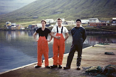 Three young friends in the harbour in Hvannasund. Hans Jacob (middle) and Arnold (right).
