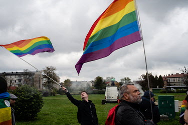 People take part in a LGBT pride march where a strong police presence sought to prevent violence before forth coming parliamentary elections.