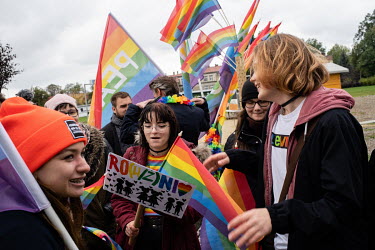 People take part in a LGBT pride march where a strong police presence sought to prevent violence before forth coming parliamentary elections.