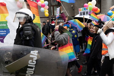 Participants in a LGBT pride march walk through the streets accompanied by a strong police presence to prevent violence before forth coming parliamentary elections.
