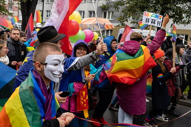 Participants in a LGBT pride march walk through the streets accompanied by a strong police presence to prevent violence before forth coming parliamentary elections.