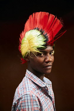 Godfree, wearing a wig in the colours of the national flag, in the Soweto Market.