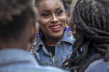 A woman who has had her hair and make-up styled for 'Hairitage Chronicles. A festival for the Natural Hair Community'.