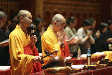 Monks lead a Buddhist ceremony in the Buddha Tooth Relic Temple in Chinatown.