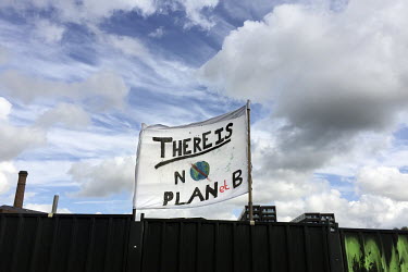 Student Environmental activists raise a sign that reads: 'There Is No Planet B' during the worldwide movement 'FridaysForFuture' or 'Global Strike for Future' climate protest.