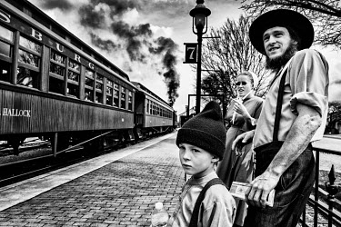 An Amish family visits the town's train museum.