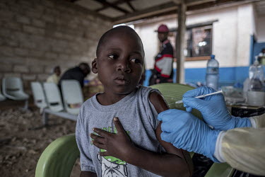 Juliane Ndoho Anita receives the vaccine for Ebola at the general hospital in Mambasa.