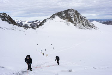 Alpinists crossing a glacier on their way to the summit of Wildspitze, the highest peak of Austrian Tirol, at 3774 metres.