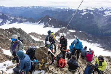 Alpinists rest on the summit of Wildspitze, the highest peak of Austrian Tirol, at 3774 metres.