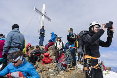 Alpinists rest on the summit of Wildspitze, the highest peak of Austrian Tirol, at 3774 metres.