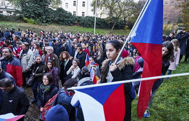 A girl carries a Czech national flag during a recreation of the 17 November 1989 march from Albertov to Avenue of the Nation (Narodni trida) during the 30th anniversary of Velvet Revolution.