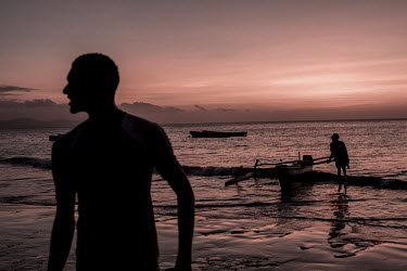Young men, all of whom said they dreamed of migrating to Mayotte, play football in the evening on the beach.