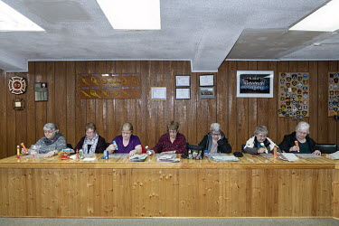 Women are playing bingo at the headquarters of the fire brigade in the remote town of St. Anthony.