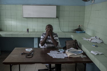 A doctor in the nearly empty government hospital in Domoni. Healthcare is so poor in the Comoros that people risk the dangerous journey to Mayotte for even minor complaints such as hernias.