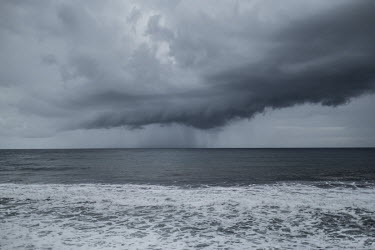 A rainstorm erupts off the coast of Anjouan.