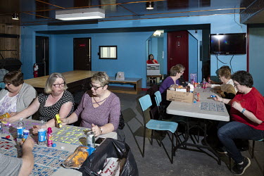 Women are playing bingo at the headquarters of the fire brigade in the remote town of St. Anthony.