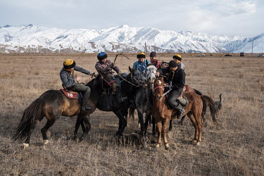 Electrician Turat Eshcojo Uulu (second from right) competes in an inter-village game of Kok Boru near the village of Suusamyr, which lies above 2000m in a valley of the same name in the Tian Shan Moun...