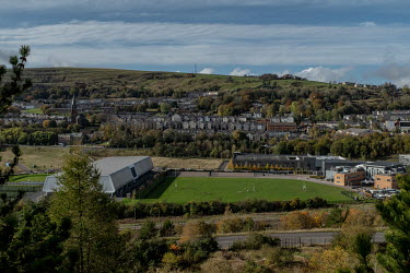 A rugby match takes place on a sports field on the valley floor which was, until 2002, the location of the Ebbw Vale Steelworks. The Steelworks closed in 2002 and since then the local council and Wels...