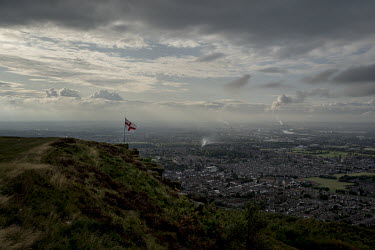 An English flag flies over Teeside on a hill known as Eston Nab overlooking the town of Redcar.