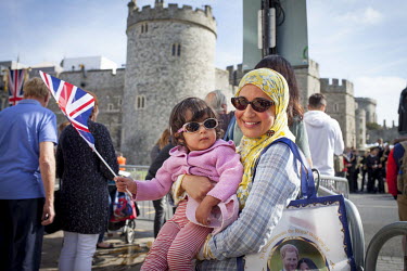Sanaa (42) and Lily (2) from Ascot (originally from Morroco) drove into Windsor for an hour to get a glimpse of the build up to the following day's Royal Wedding. 'It is about two people from differen...