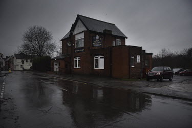 Rain falls on the New Bolsover Social Club in one of the poorer parts of the town of Bolsover.