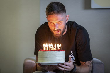 French footballer, Olivier Giroud, who plays for the Premier League club Chelsea and the France national team, talking about his Christian faith to French journalists, who presented him with a cake fo...