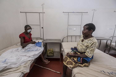 Sahura Mussa (in red) and Aziza Daudo (beige) recuperate after successful cataract operations at the Nampula hospital.